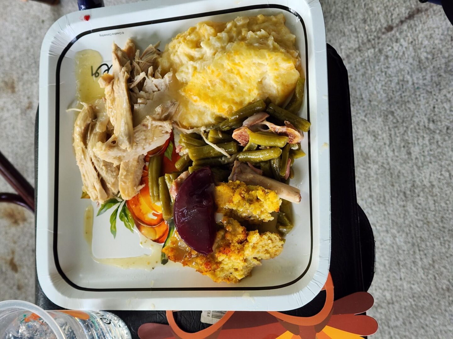 A plate with chicken, stuffing, and vegetables